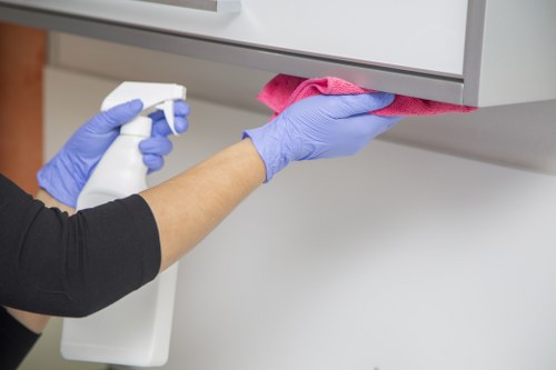 Deep cleaning a bathroom with scrubbing and sanitizing supplies